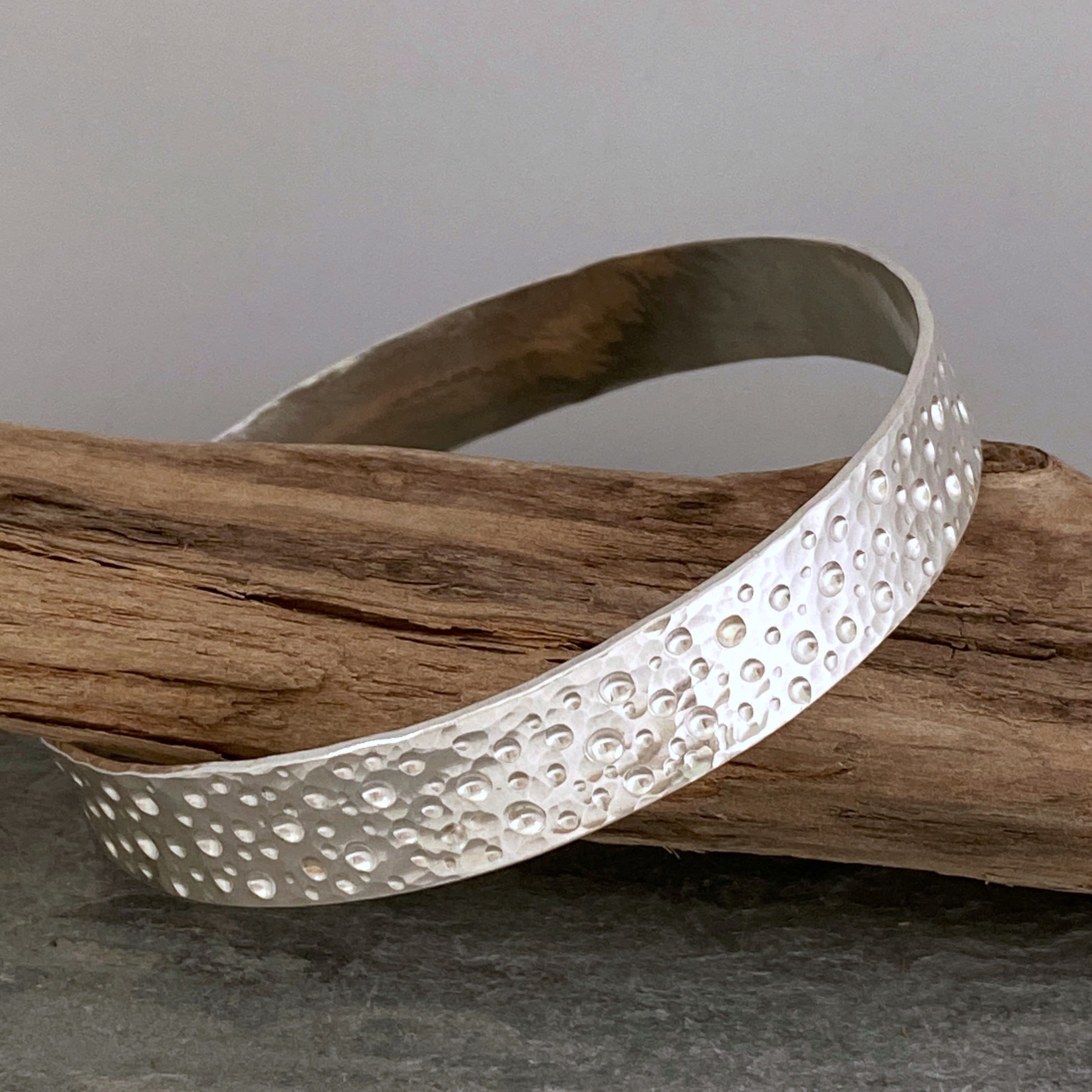 Wide Hammered Silver Bangle With A Unique Bubbles Pattern, Made From Recycled Sterling