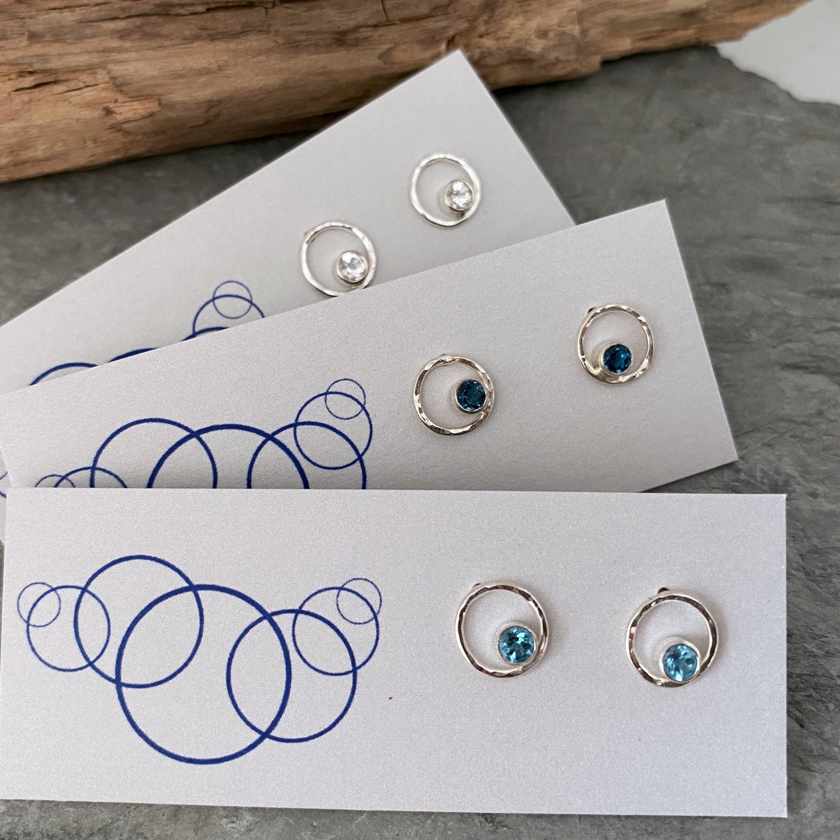 Small Blue Topaz Earings Made From Hammered Silver Circles With Gemstones Inside