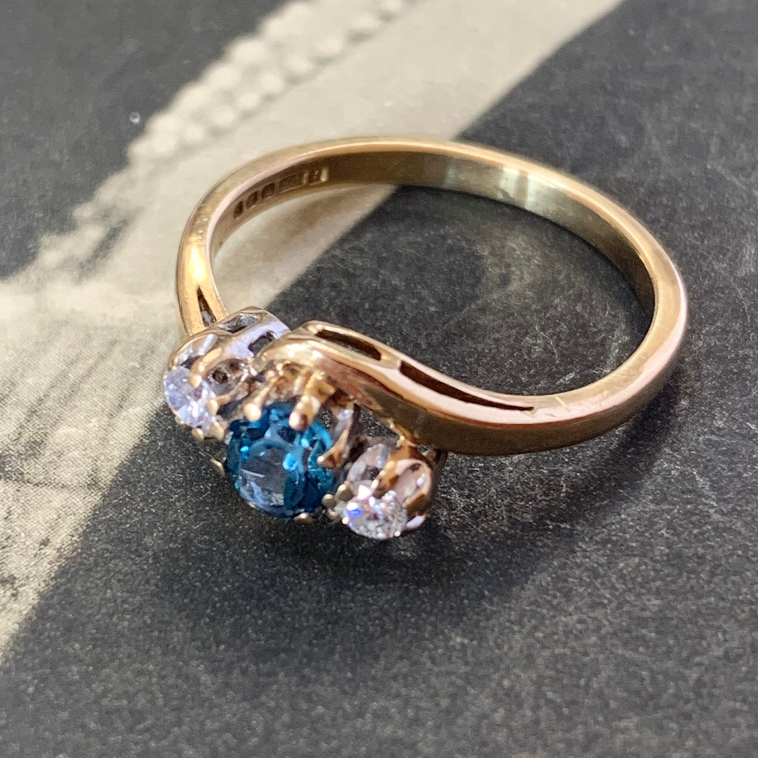 Vintage Engagement Trilogy Ring With A Stunning Combination Of Blue Topaz & Quality Diamonds in Bypass Twist Set 9Ct Yellow Gold