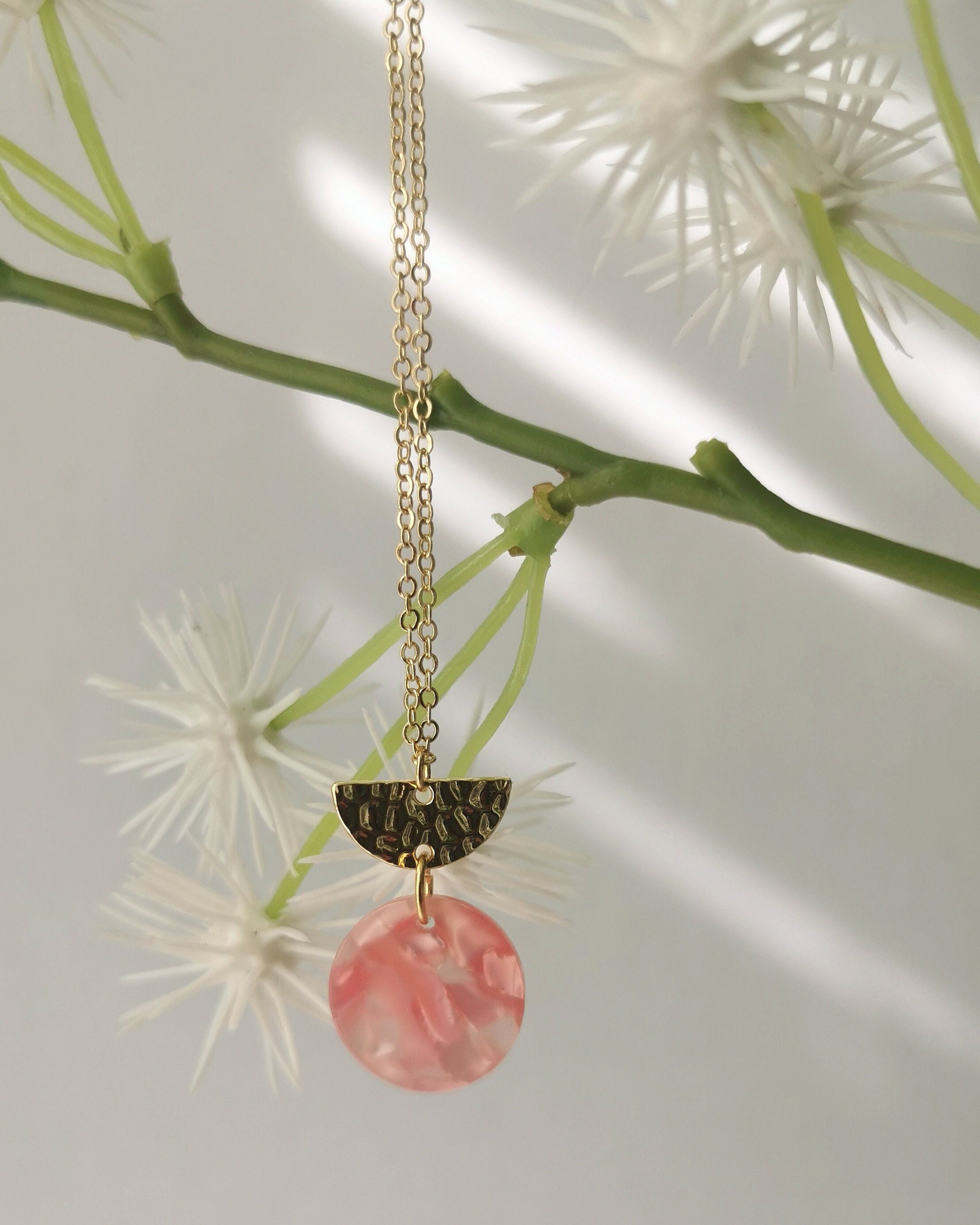 Geometric Necklace With Half Moon Textured Brass & Pink Tortoiseshell Circular Acrylic Charm On A Gold Plated Fine Chain