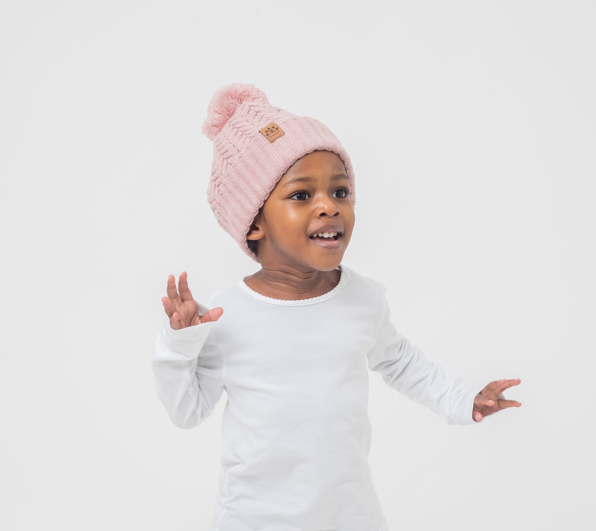 Satin Lined Child’s Pink Bobble Hat