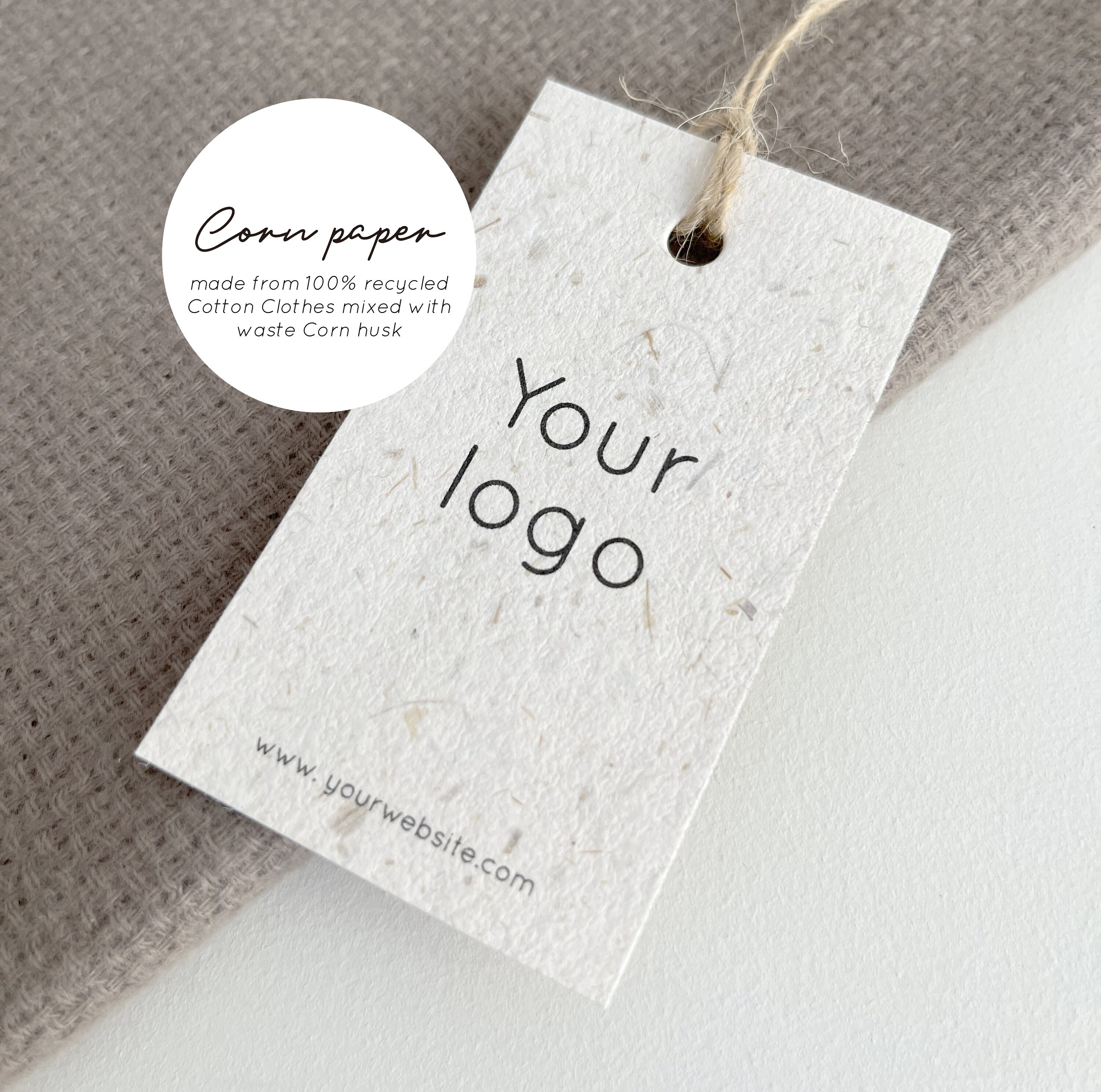 Eco paper hang tag with jute string on linen shirt