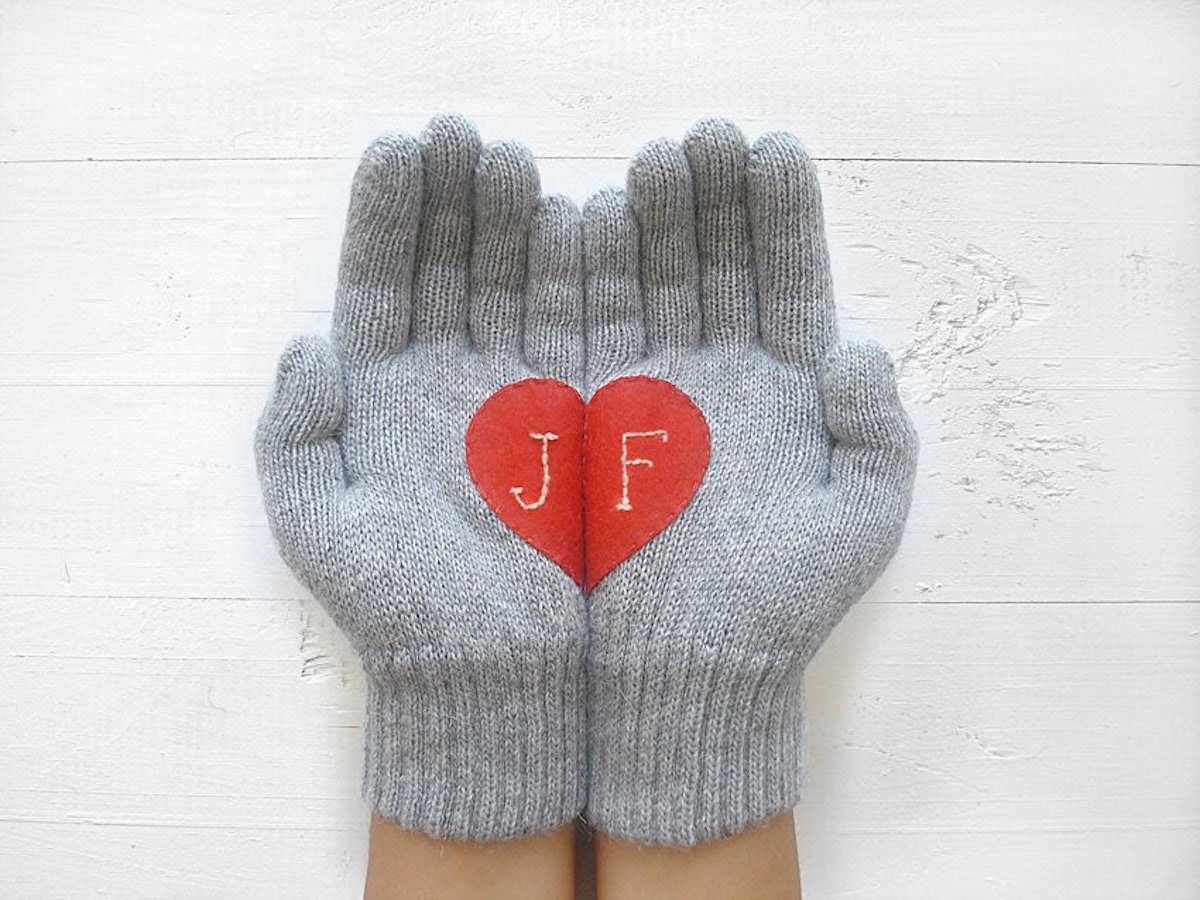 A pair of hand-embroidered monogrammed gloves.