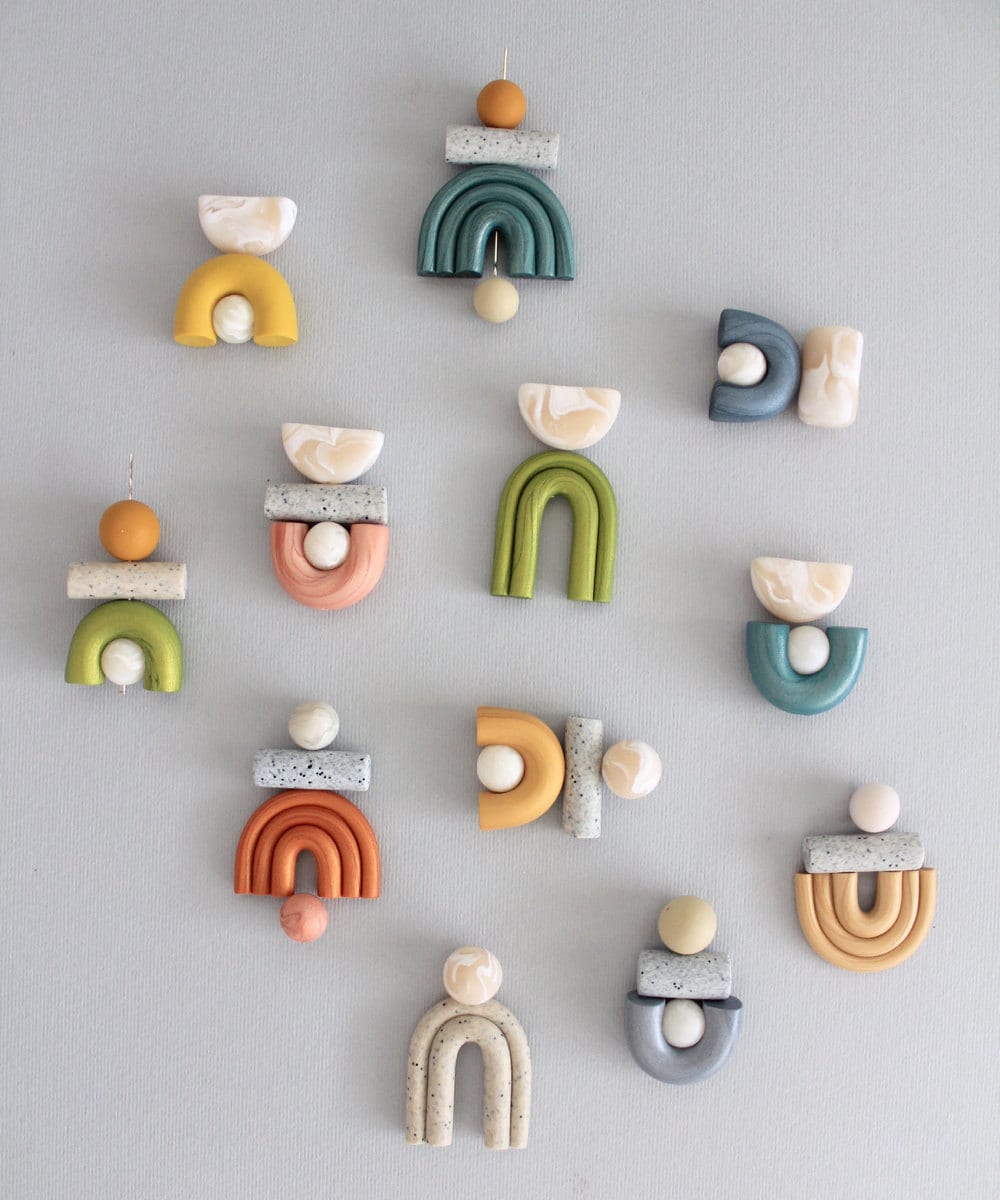 Colorful flat lay of assembled earring patterns before the hooks are added.