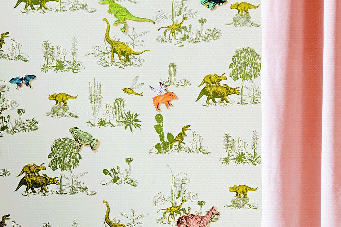 A gif of Sian's award-winning dinosaur wallpaper showing the magnetic characters moving about the wall.