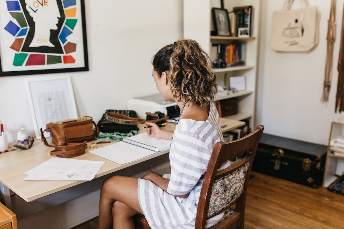 Jacqueline Flaggiello in her studio, seated at her desk