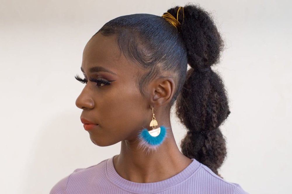 Mixed metal and feather statement earrings from Vintage Royalty