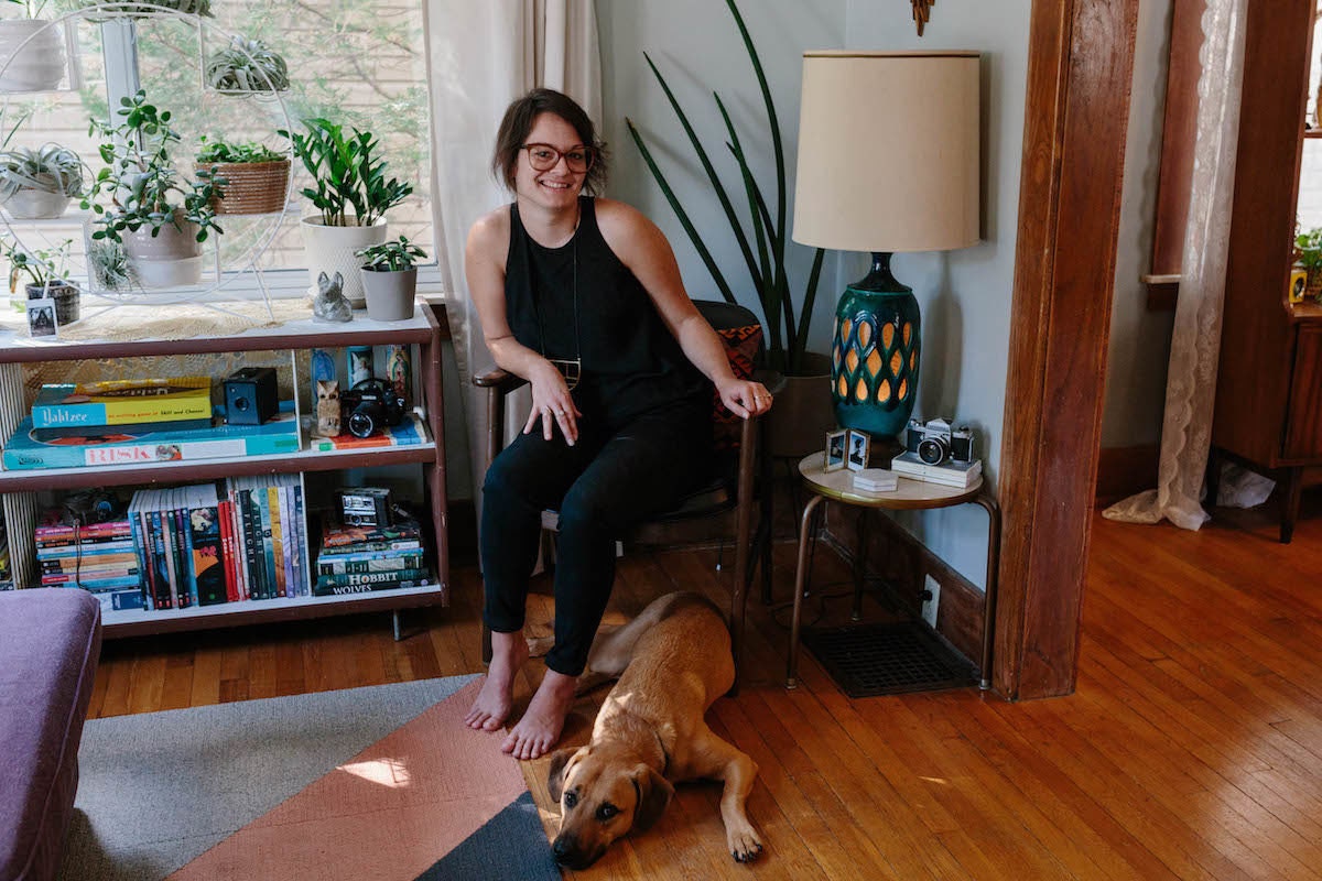 Brenda in her home with her dog