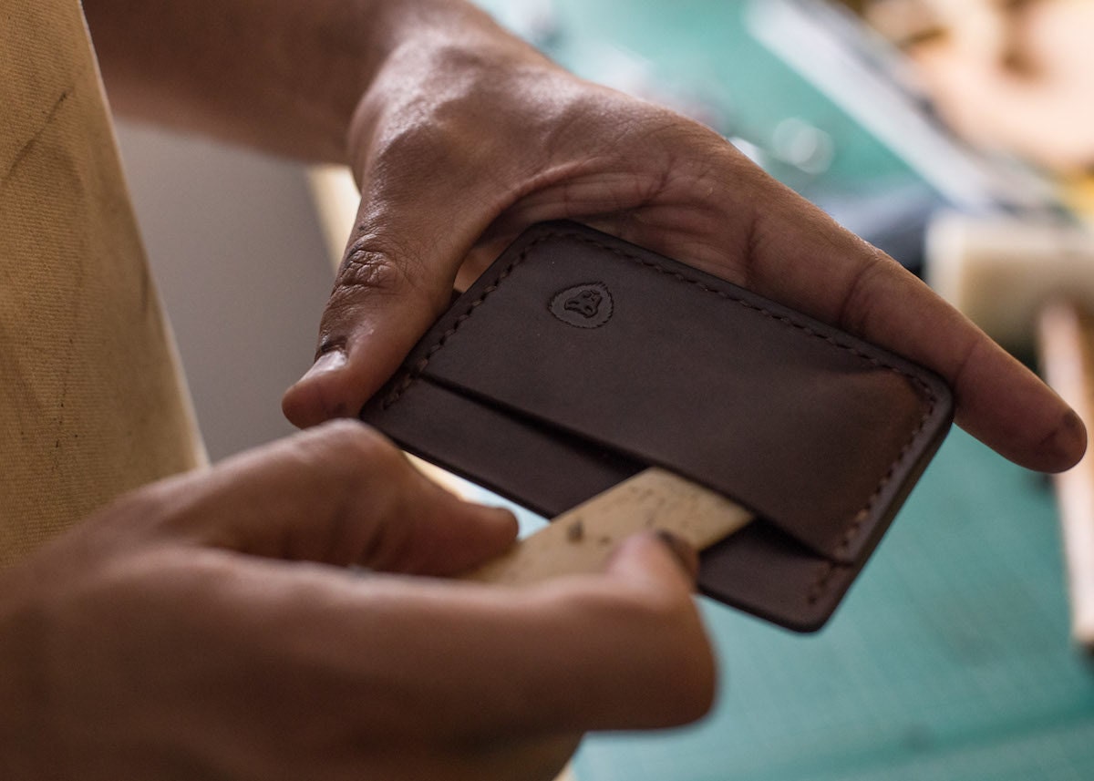Kingsley at work on a card case