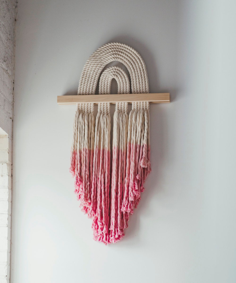 A pink dip-dyed macrame wall-hanging from Candice Luter