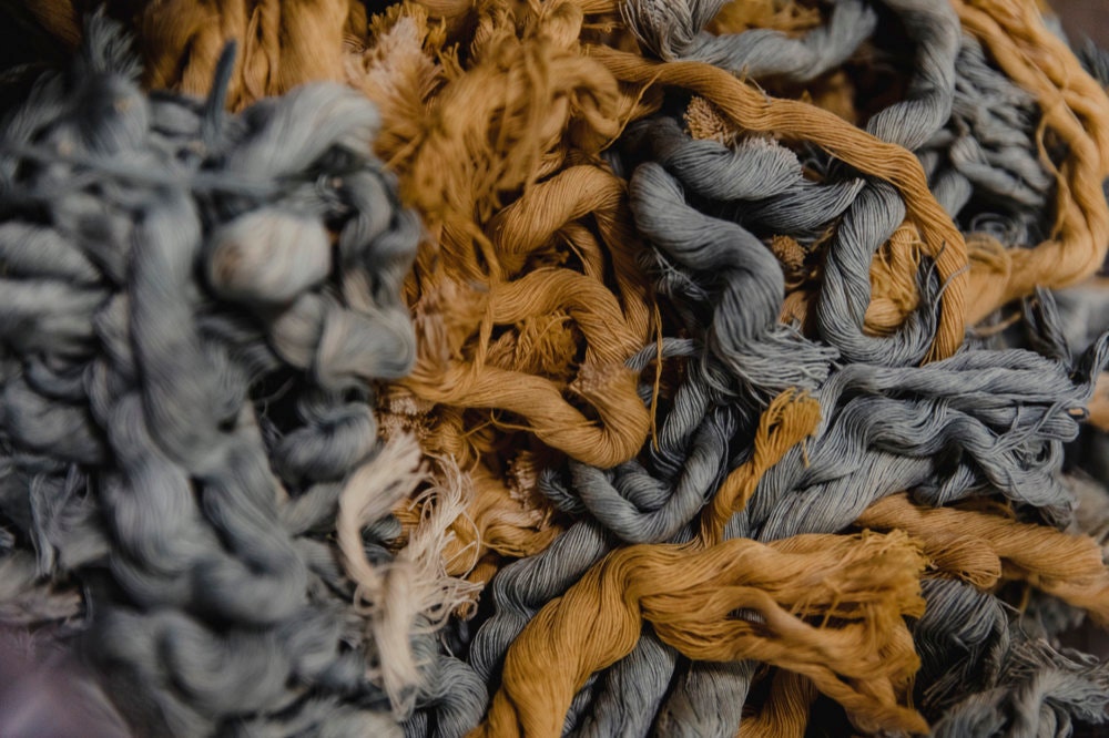 A closeup of blue and gold fiber strands.