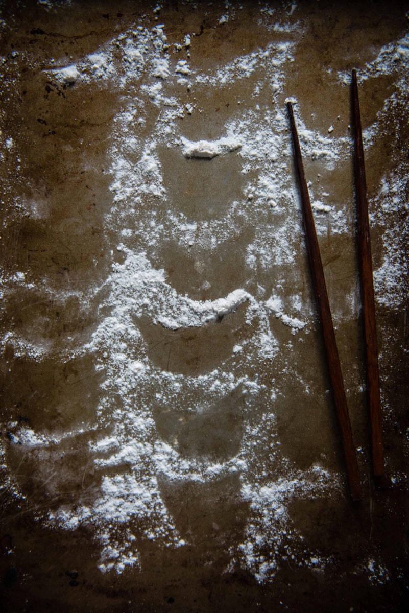 The flour outlines of the dumplings on a tray