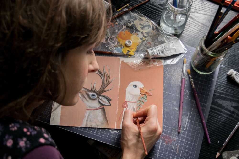 Kayleigh painting holiday cards