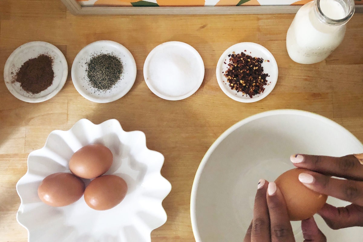 Combining the eggs and spices Combining the eggs and spices