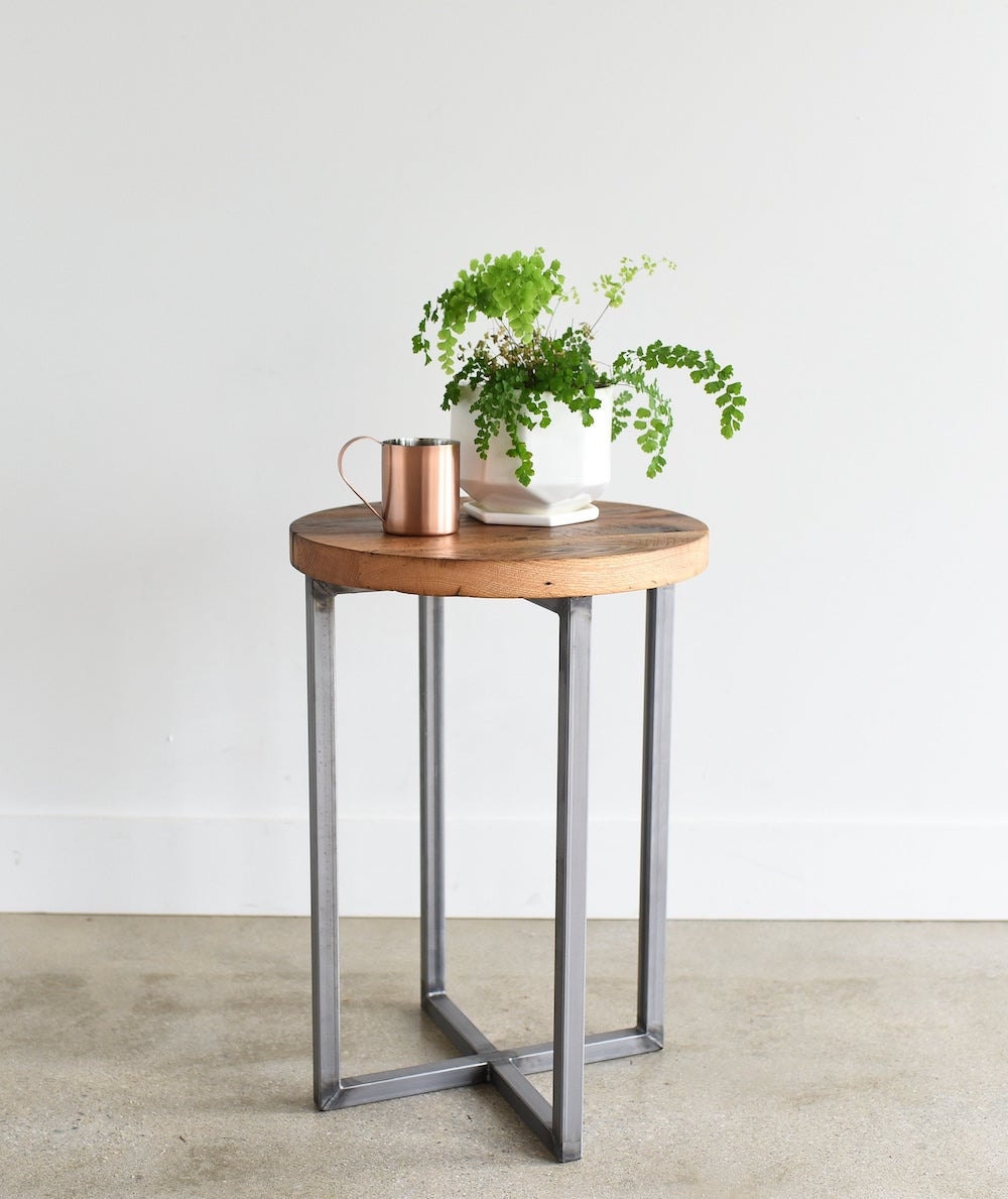 Round reclaimed wood end table with steel base from What WE Make