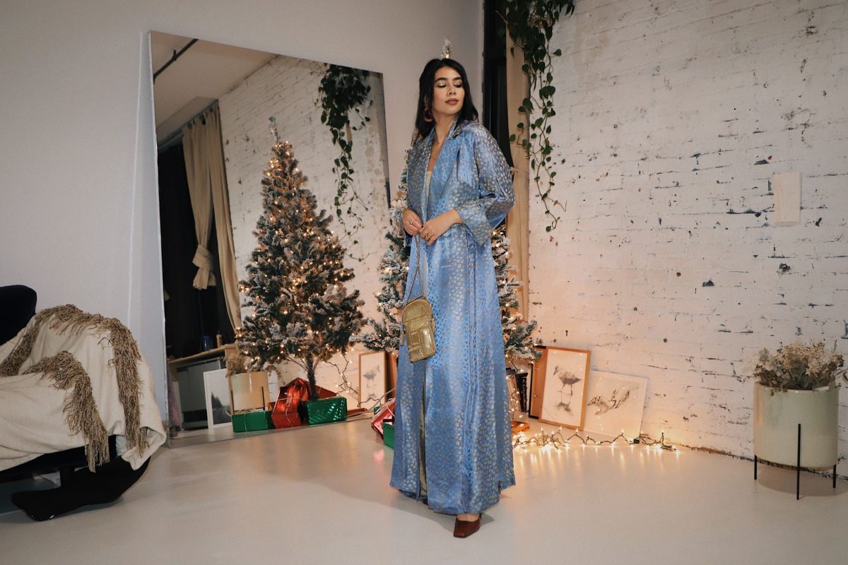Tara Mazuki models a festive holiday party outfit from Etsy