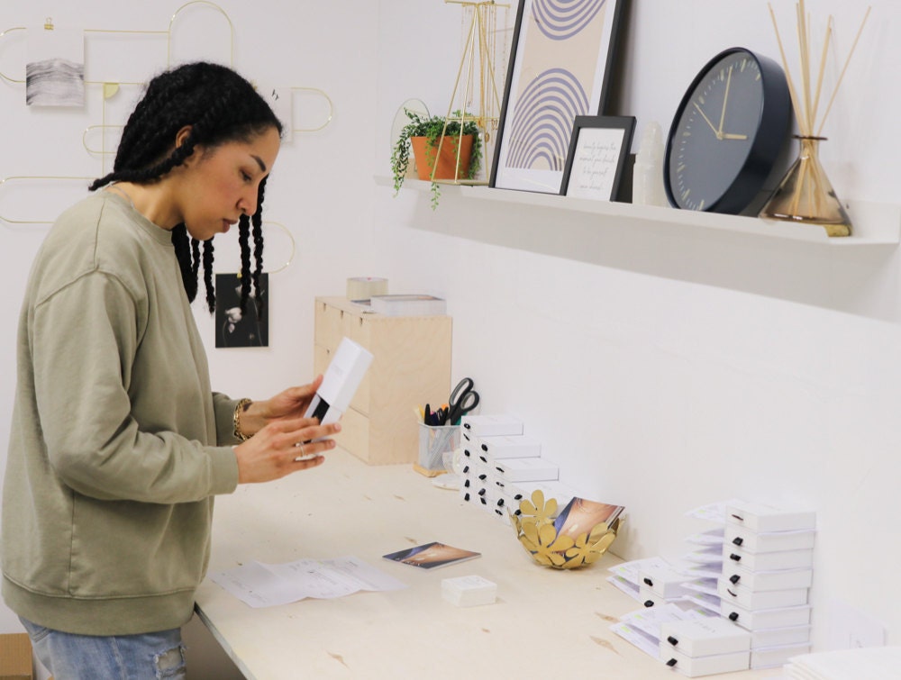 Sabrina packages up orders in her Vancouver studio space.