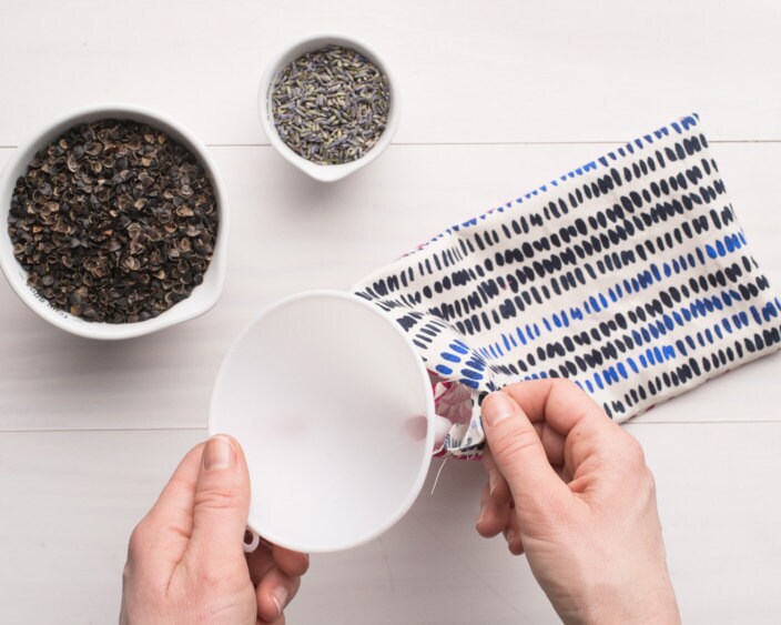 Filling the pouch with buckwheat and lavender