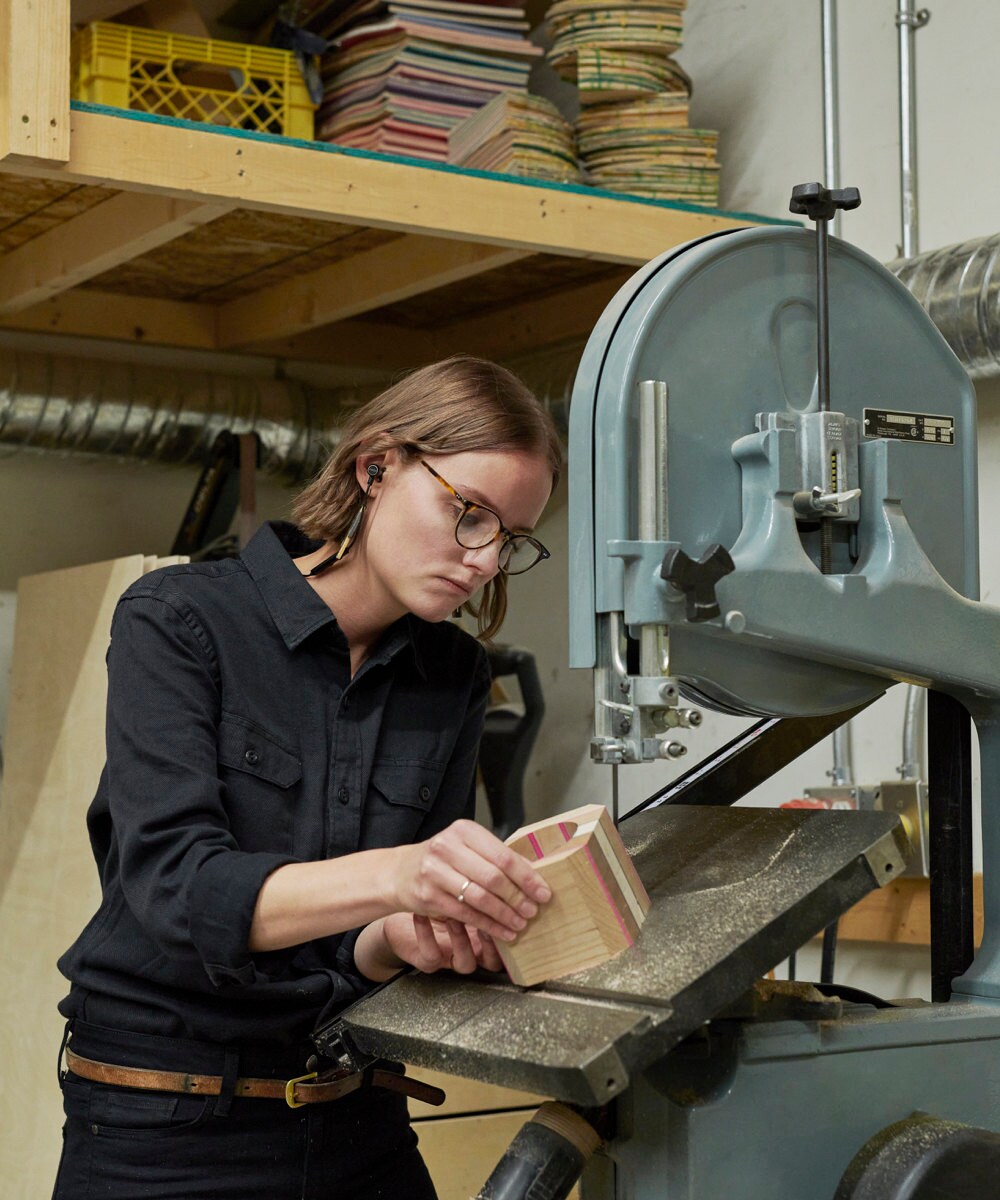 Anne works on a recycled skateboard planter in the AdrianMartinus workshop.