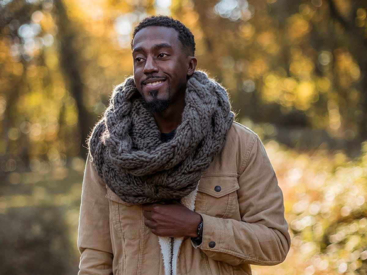 Knitwear designer and Loop'n Threads owner Nathan Bryant models one of his winter cowls
