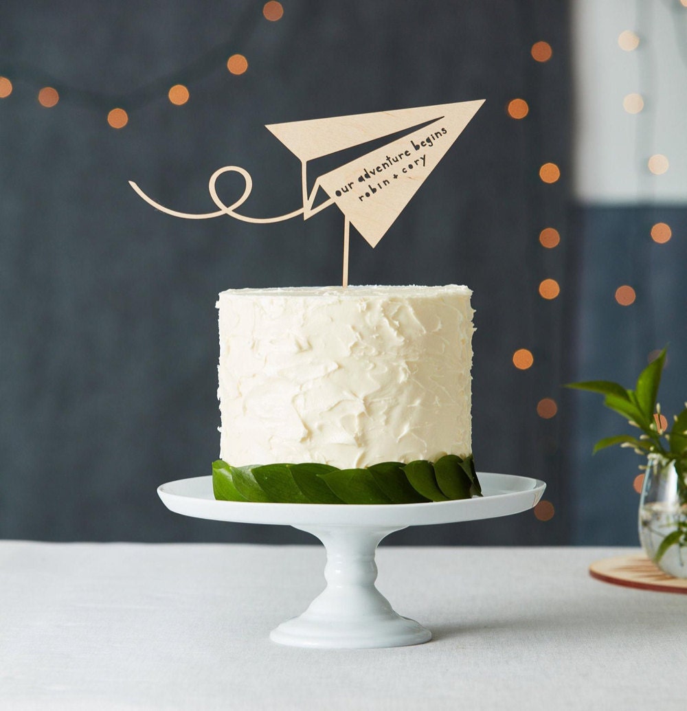Personalized paper airplane wedding cake topper from Light + Paper
