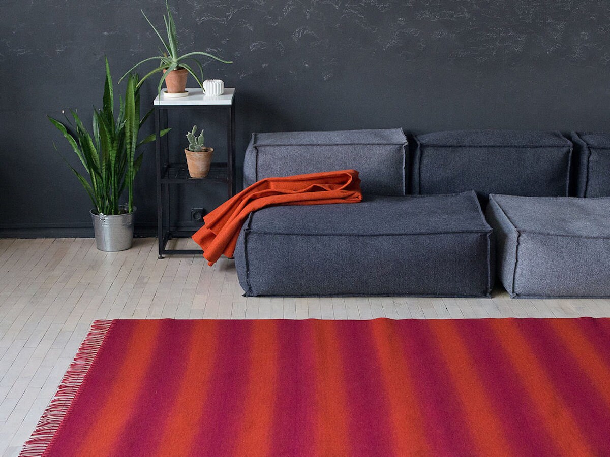 handmade red striped rug in a living room