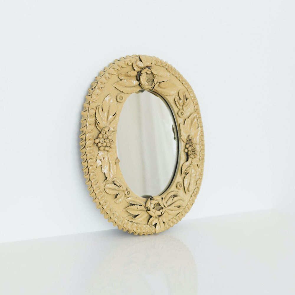 A vintage folk floral mirror from Otherwise Shoppe