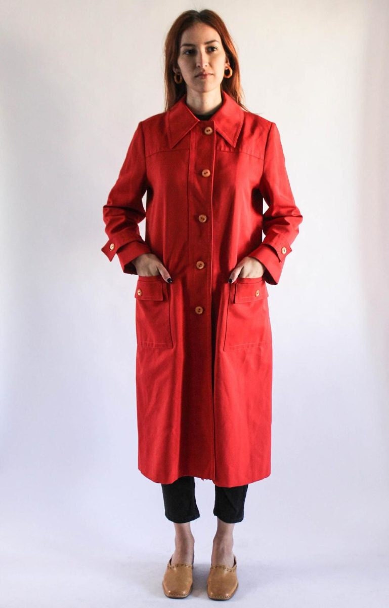 A vintage red trench coat from Shop La Flor
