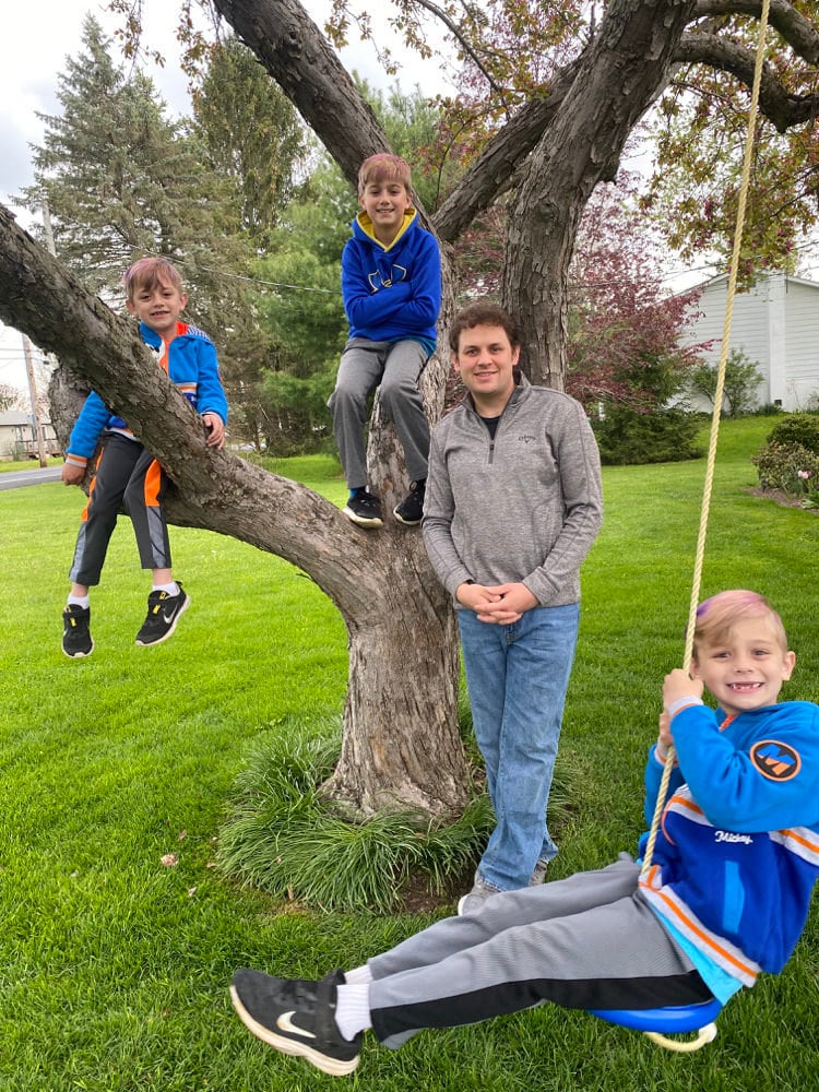 A portrait of Case Mediation Specialist Montgomery Bopp and his 3 sons.