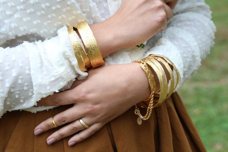 Large etched gold bangles from Lingua Nigra