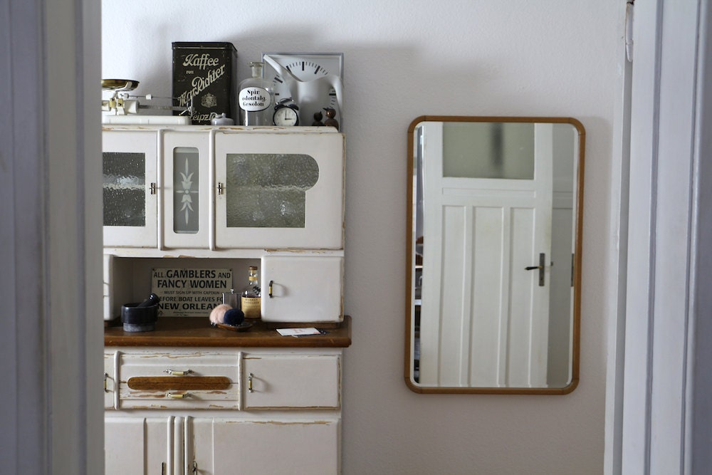 Vintage items arranged on a cabinet