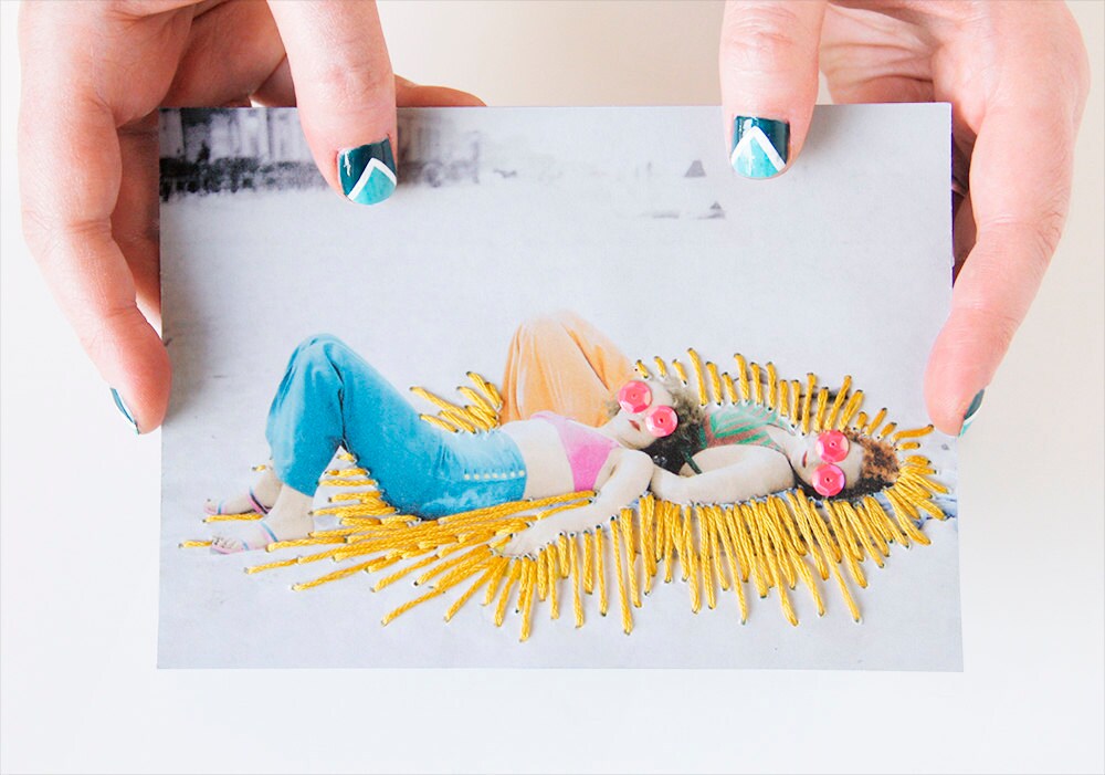 DIY embroidered photograph of two sunbathers