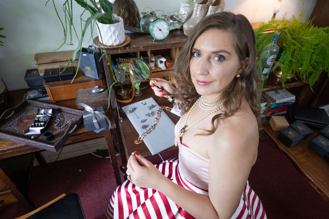KK examines a vintage necklace chain