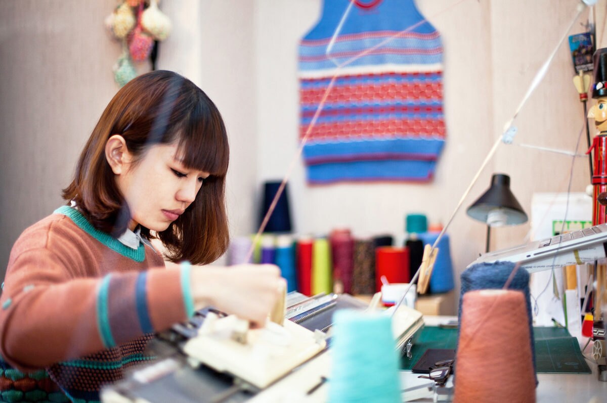 Yu Square shop owner Ringo Yu knitting in her Taiwan studio