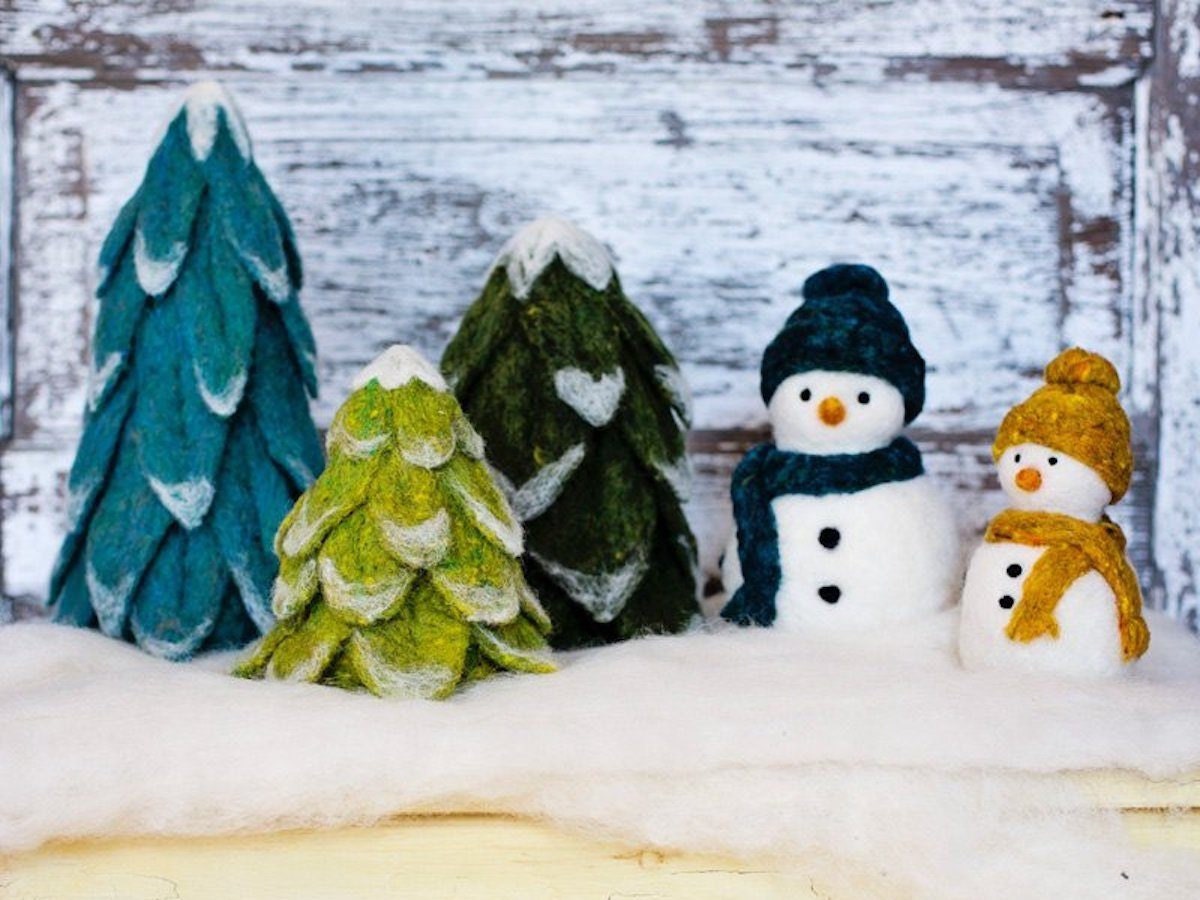 Needle felted evergreen trees and snowmen.