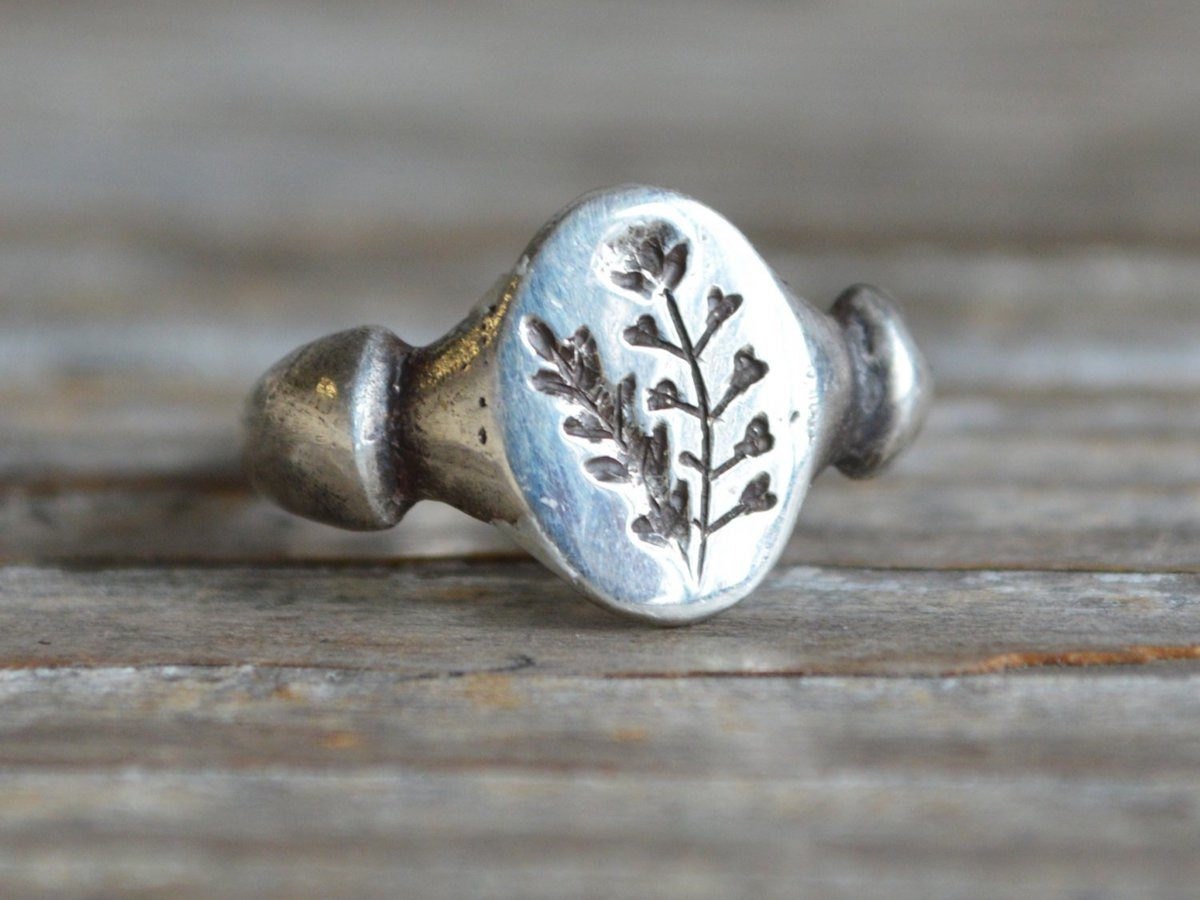 Sterling silver ring engraved with a botanical design