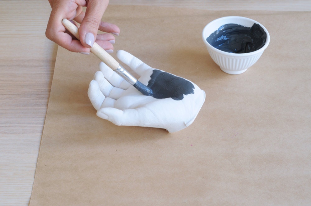 Painting the plaster hand