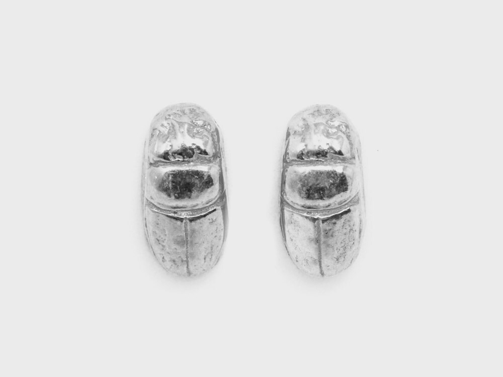 A pair of silver scarab beetle stud earrings from Omi Woods