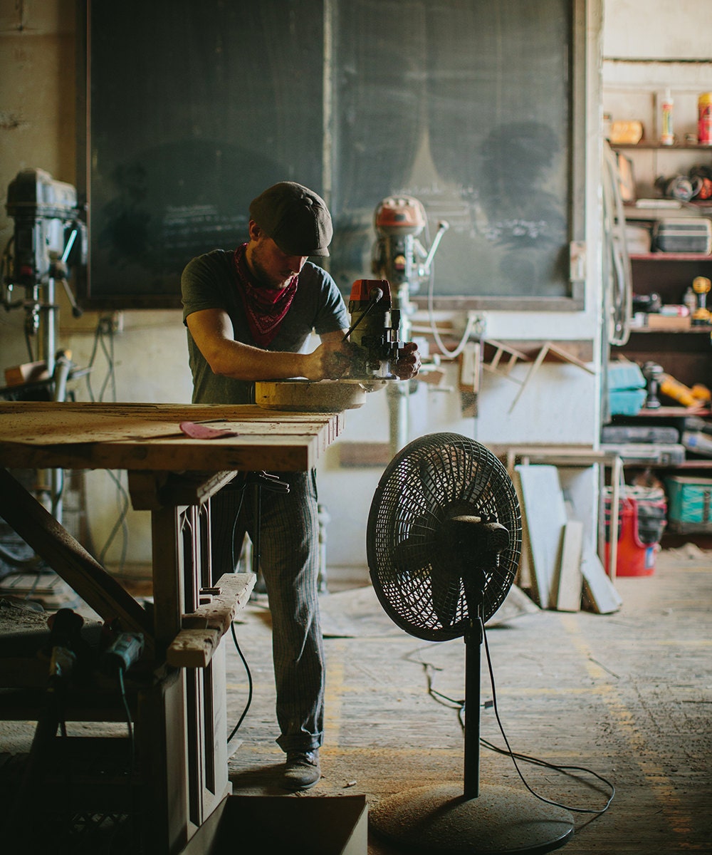 Walter woodworking in the woodshop.