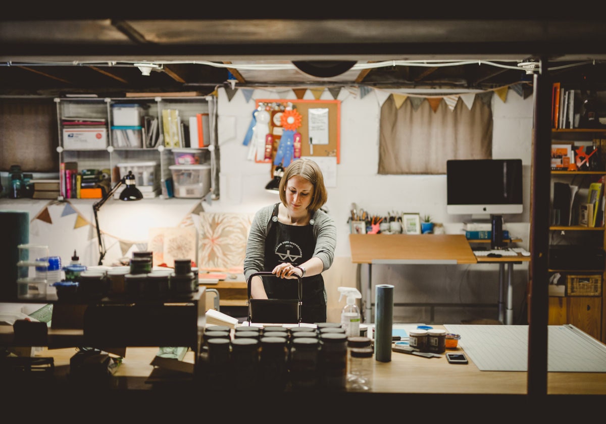 Kari and her husband spent memorable moments of their courtship at a bookstore. When it went out of business, she bought a long book display table, where she now prints in her basement studio.