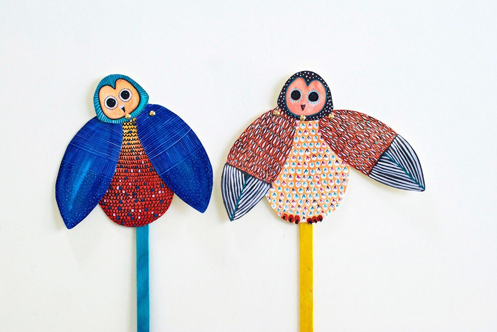 Two owl puppets with moving wings made of paper