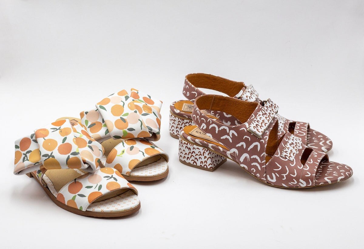 Orange print slip-on leather sandals and slingback brown printed leather sandals both from Katz and Birds