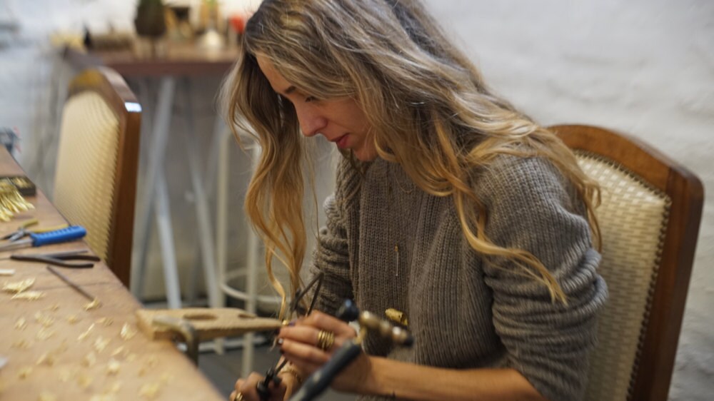 Maria working on jewelry in her Mexico City studio