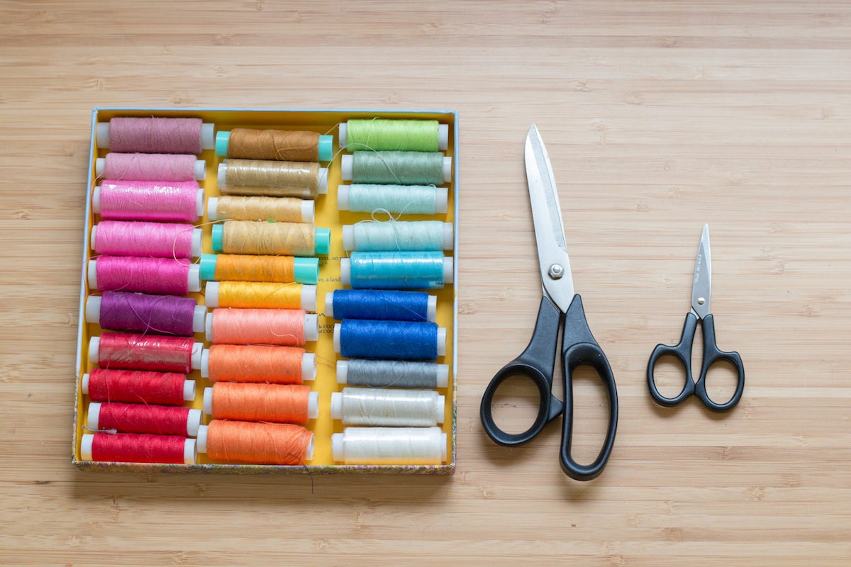 Assorted colorful thread and scissors in Inbal's studio