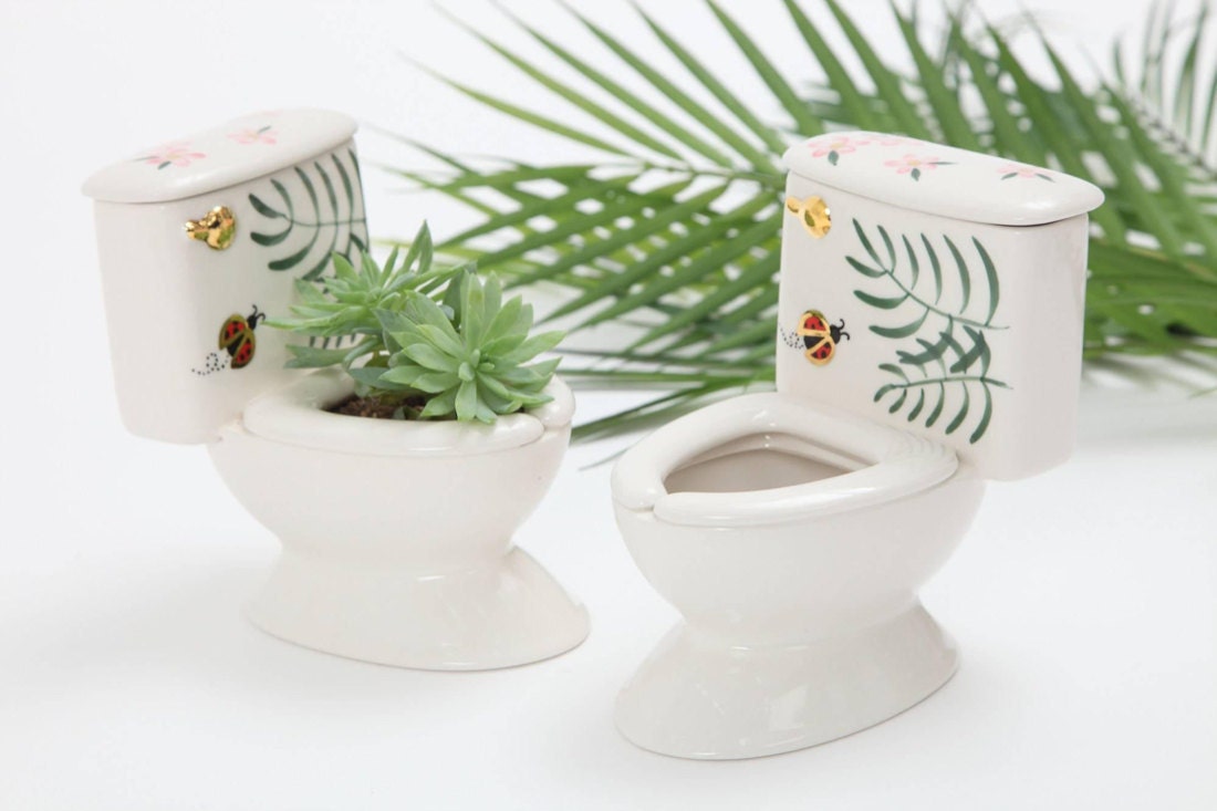 A set of two miniature porcelain toilet planters from MsPotterCeramics