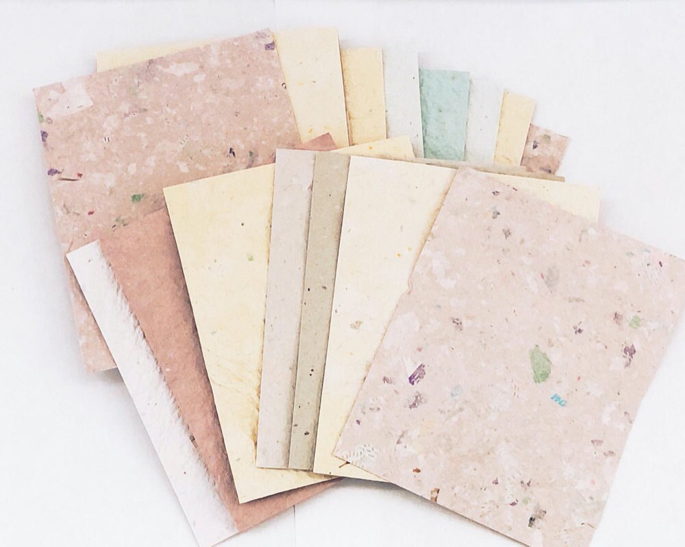 A pastel set of textured, recycled craft papers.