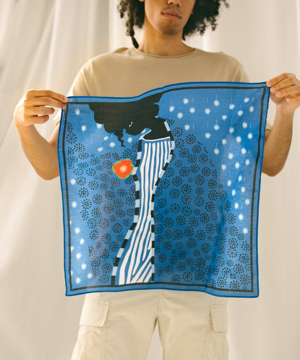 A model holds up a "Me time" bandana design from All Very Goods