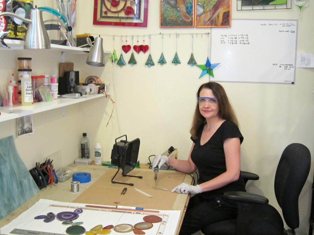 Alla at her desk in her studio