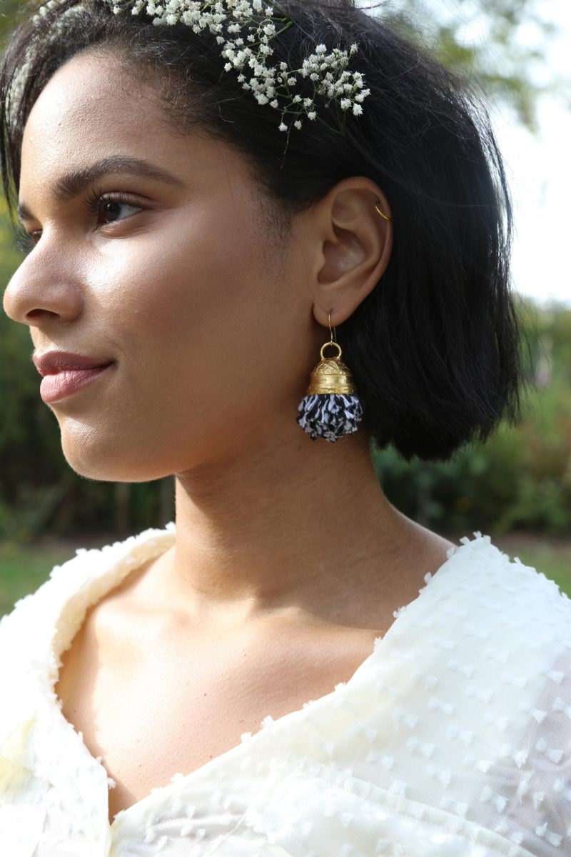 Gold-plated pom-pom earrings from Lingua Nigra