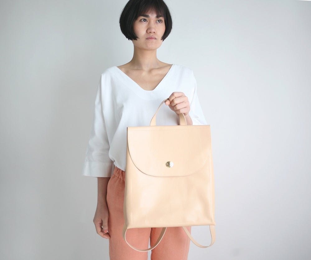 A minimalist leather backpack from Alex Bender in nude